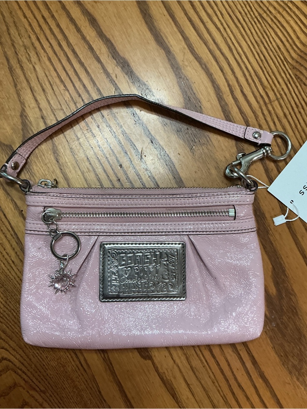 Coach Pink Leather Wristlet with Silver Plaque and Charm